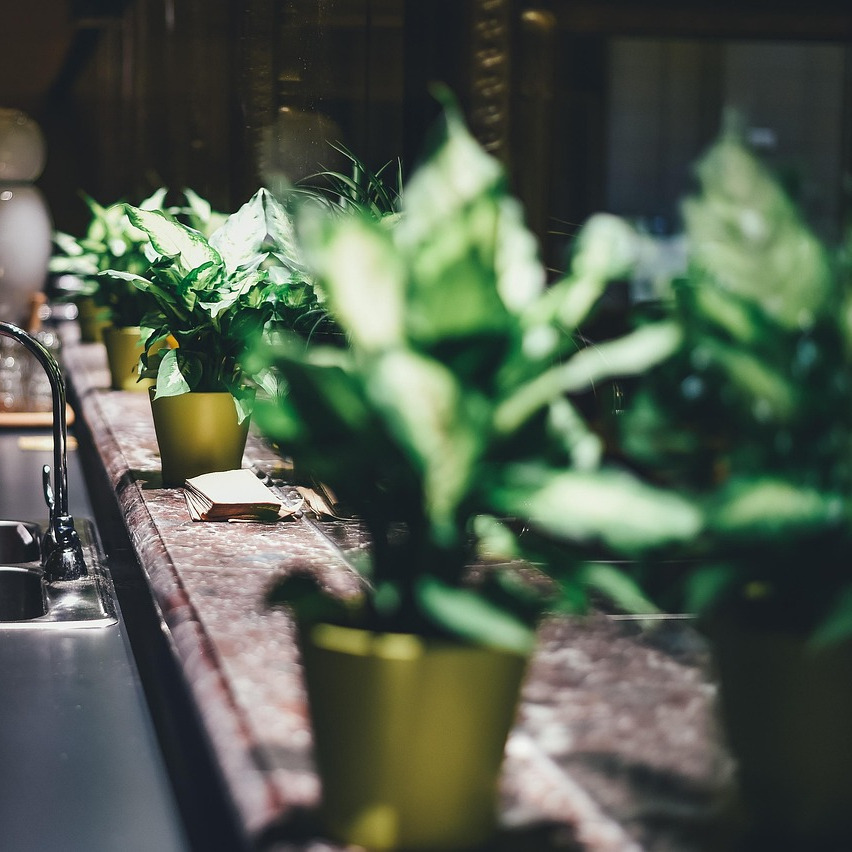 plumber repairing sink wrench kitchen